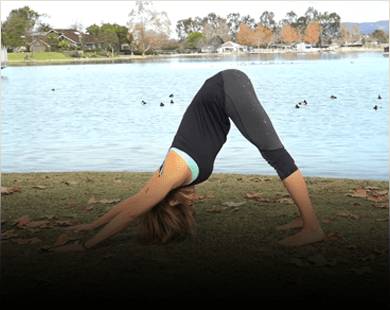 The woman who wears a custom wig is doing Yoga.